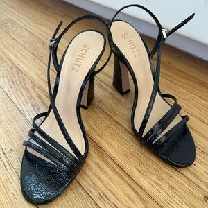 Schutz sculptural high heeled sandals. Color: black